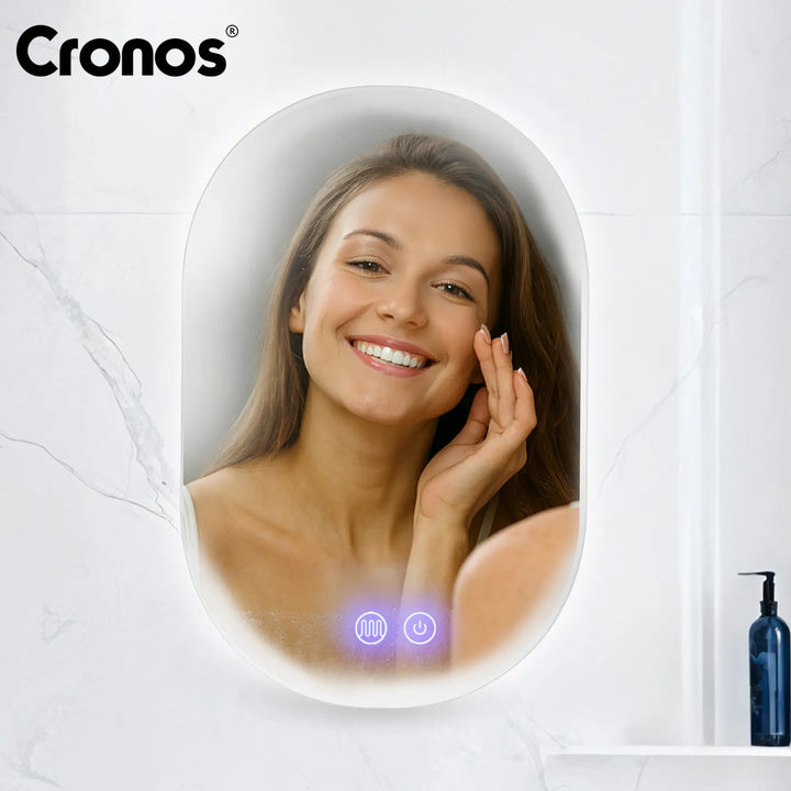 Specchio riscaldato Cronos, ovale 50x80 cm, LED a tre colori, grado di protezione IP44, sistema antiappannamento